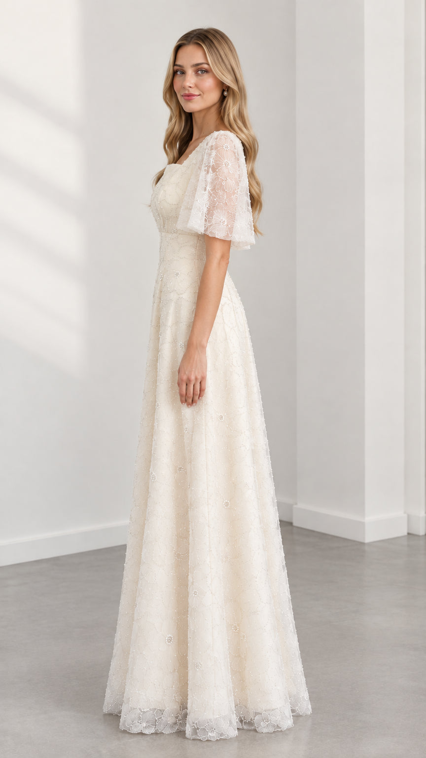 Side profile of cream embroidered lace A-line evening gown