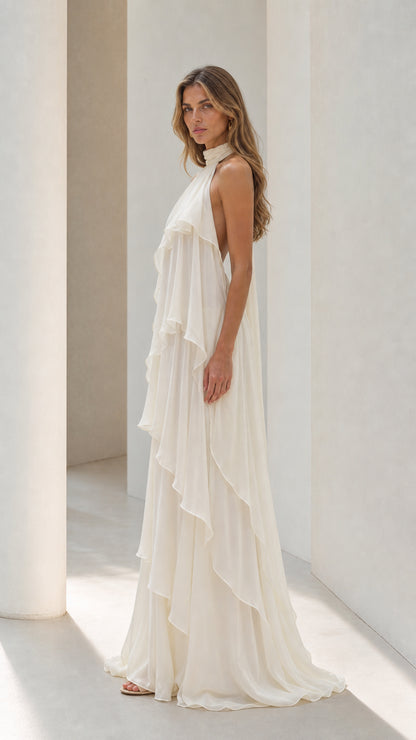 Ivory backless halter maxi dress side view showing tiered ruffles