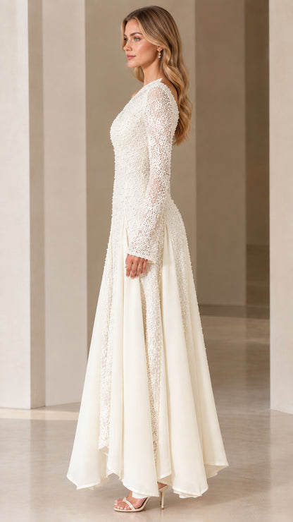 Side view of Ivory long-sleeve lace evening gown showing elegant drape