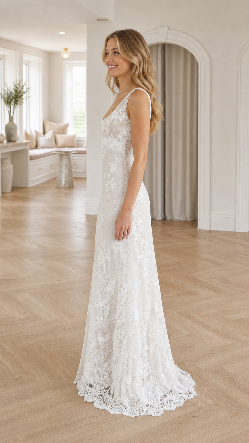 Side profile view of model in white lace gown