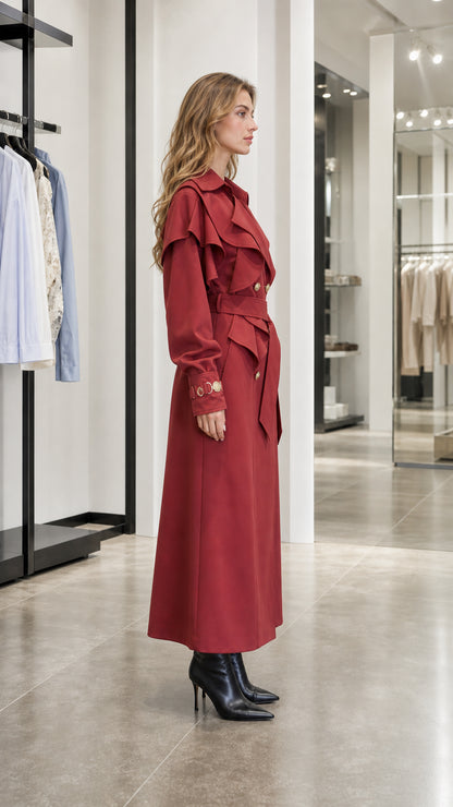 Side profile view of woman in red trench coat