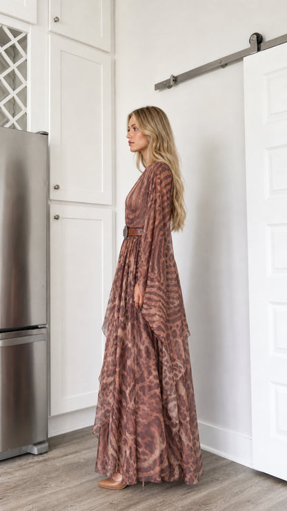 Side profile view of woman modeling the brown draped sleeve flowy maxi dress
