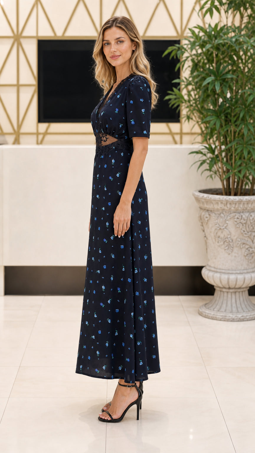 Side profile of model in Navy Blue short sleeve floral maxi dress
