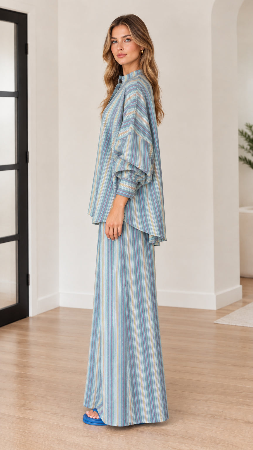 Side profile of woman wearing blue striped two-piece matching set