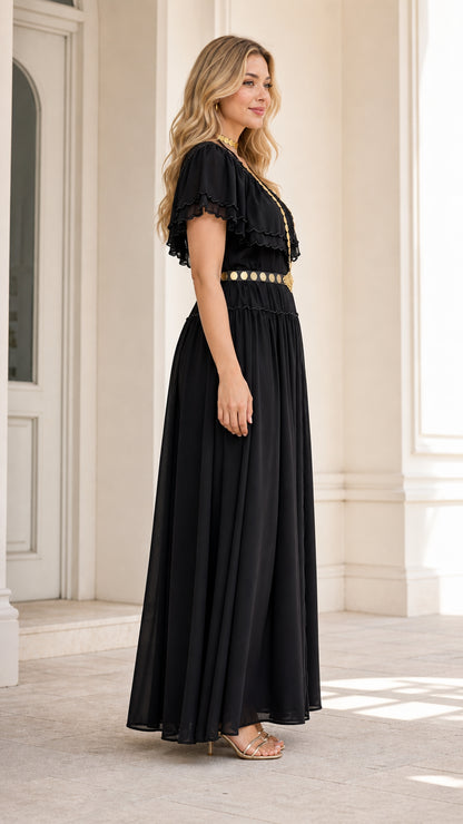 Side profile of model wearing black flutter sleeve chiffon maxi dress