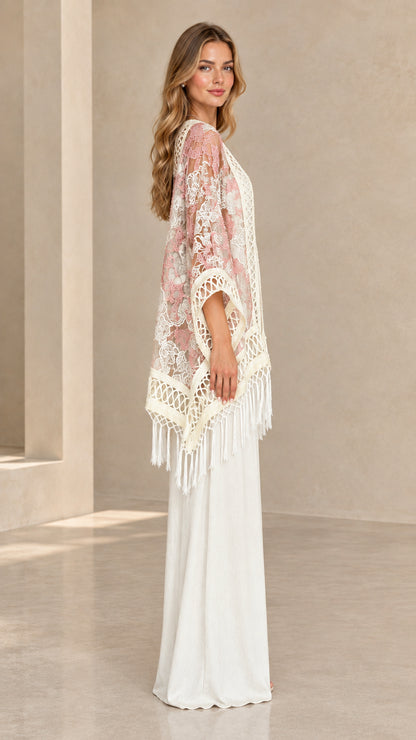 Side profile of woman showcasing the drape and sleeve of blush pink lace kimono