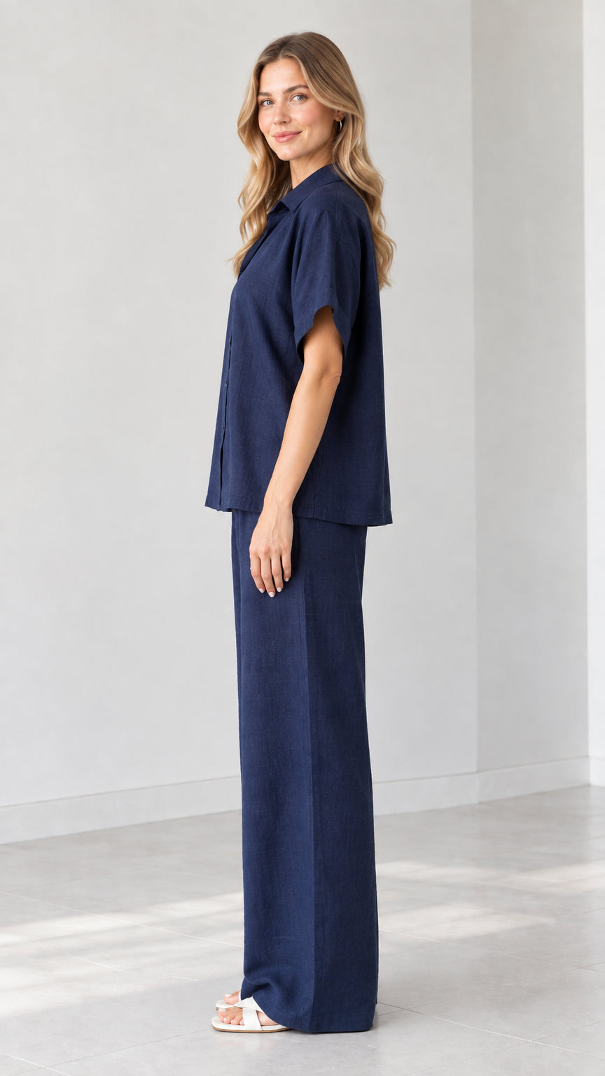 Side view of model wearing Navy Blue matching two-piece pant set