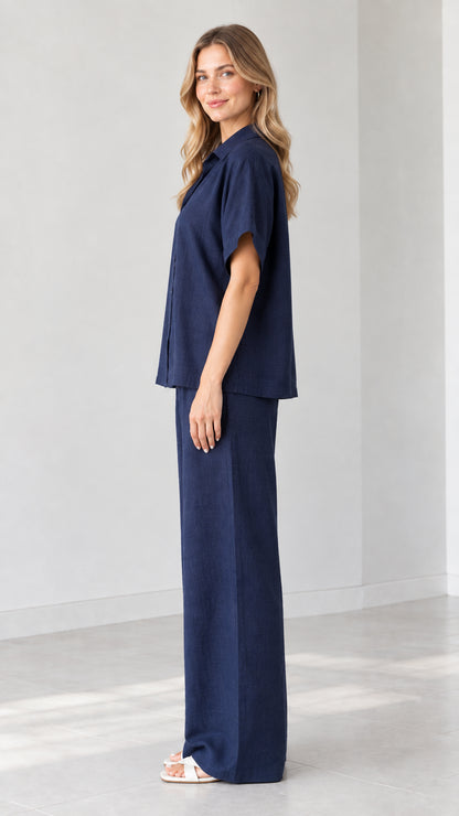 Side view of model wearing Navy Blue matching two-piece pant set