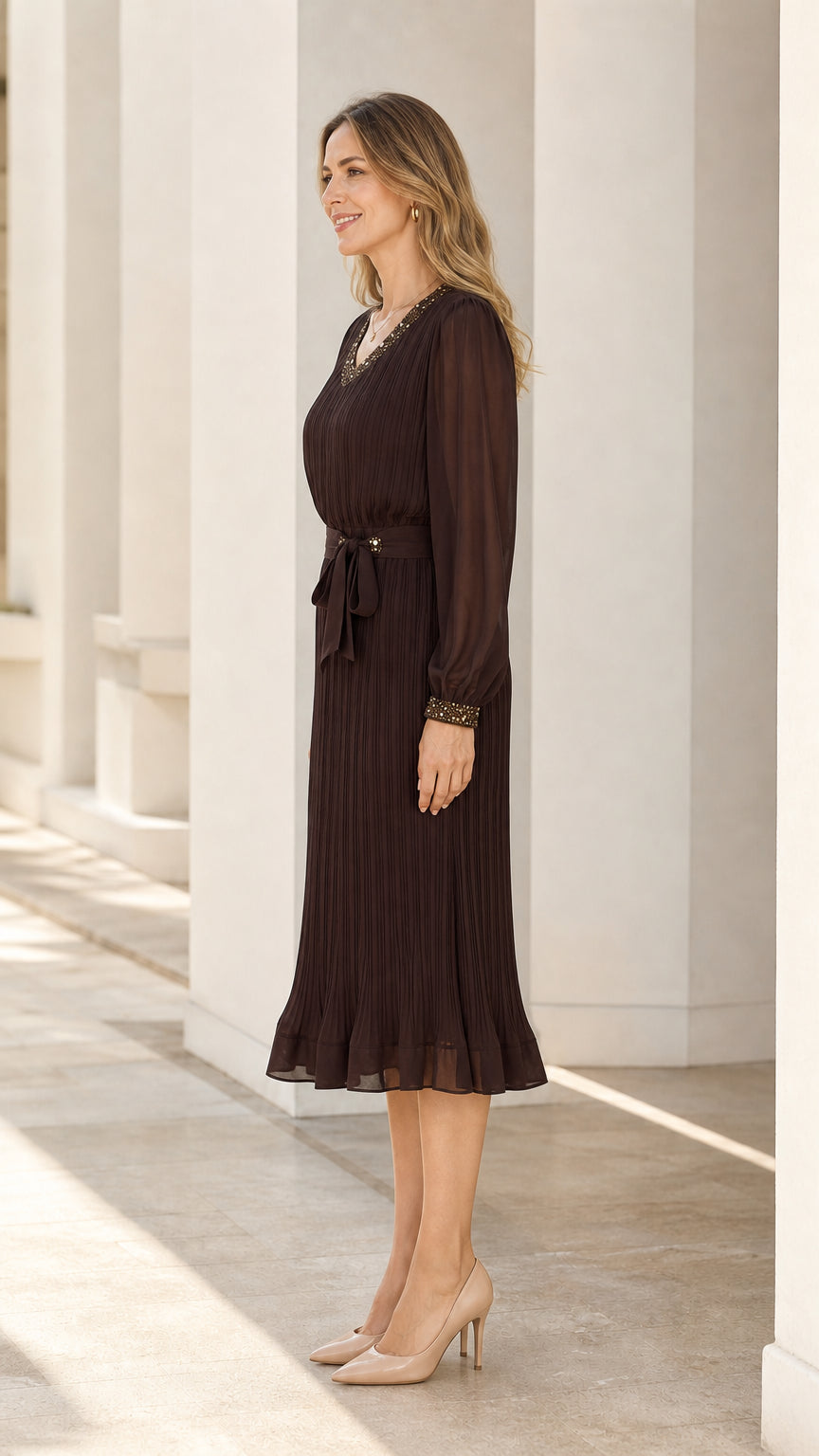 Side profile of dark brown pleated midi dress