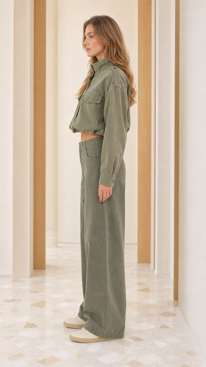 Side profile of model wearing Sage Green utility cropped jacket and wide-leg trousers