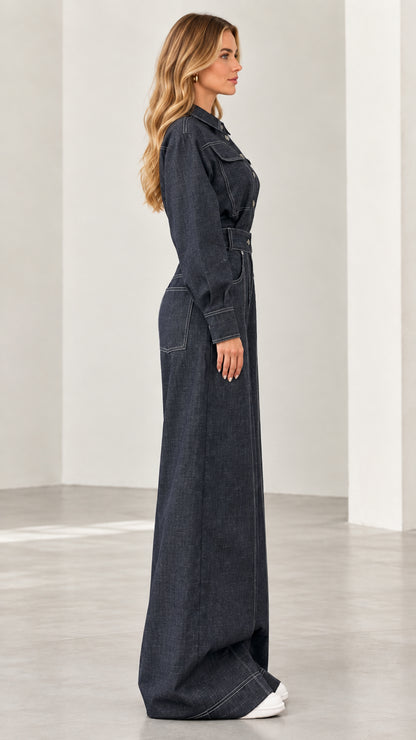 Side profile of model wearing dark blue belted wide-leg denim jumpsuit