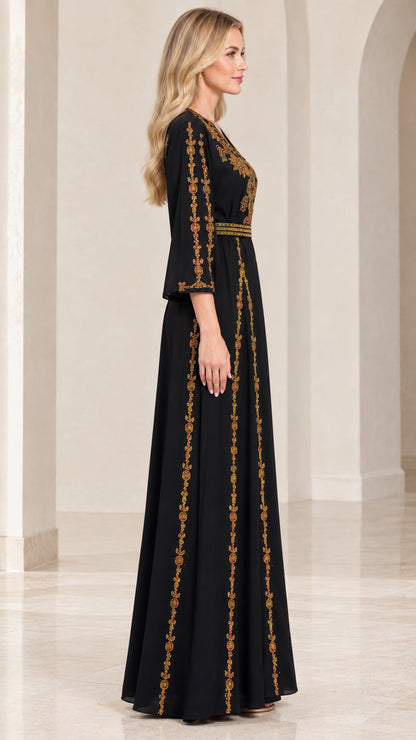 Side profile of woman wearing black embroidered maxi dress