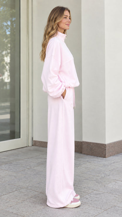 Side view of woman in Light Pink two-piece fleece loungewear set