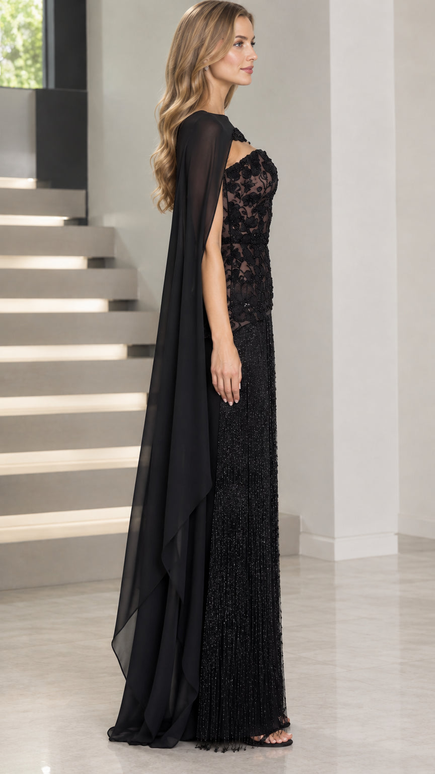 Side profile of black beaded lace formal dress with floor-length flowing cape