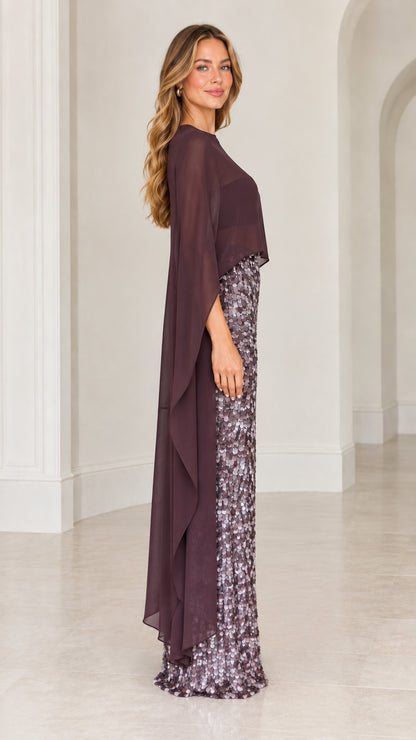 Side profile of plum formal sequin gown with sweeping capelet