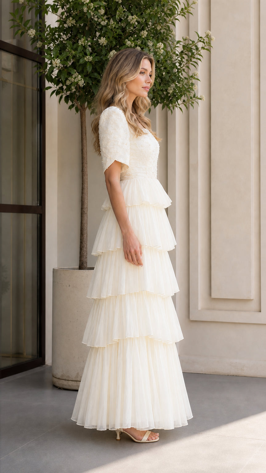 Ivory tiered tulle evening dress side profile view