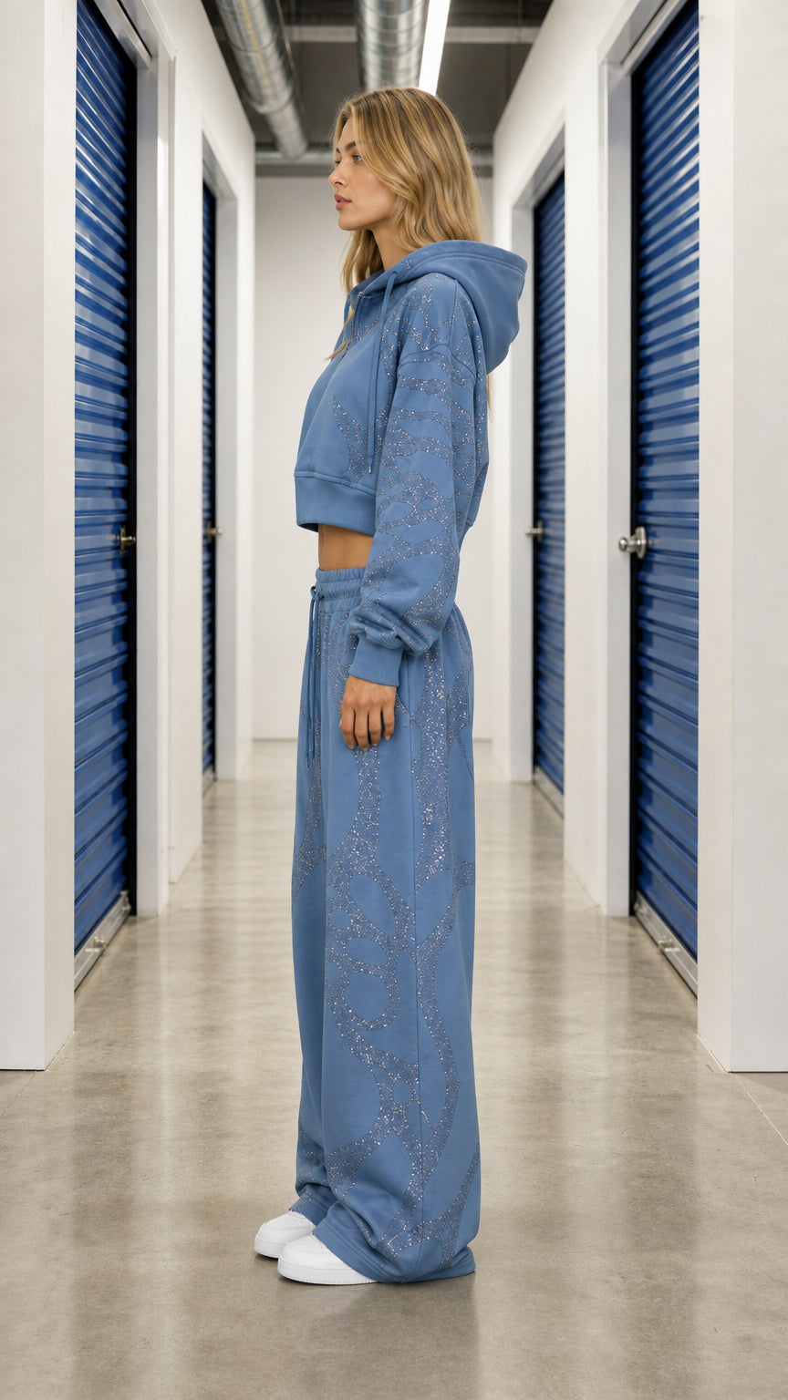 Side profile of model in Slate Blue cropped hoodie and baggy sweatpants matching set