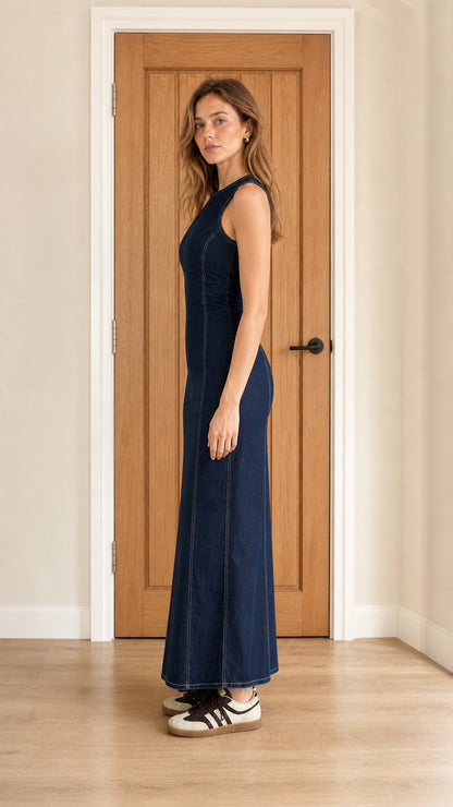 Side profile view of dark blue denim maxi dress