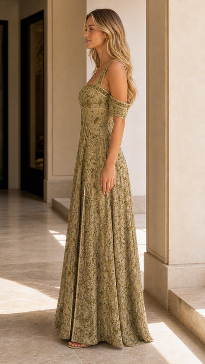 Side profile view of model wearing olive gold embroidered square-neck formal maxi dress