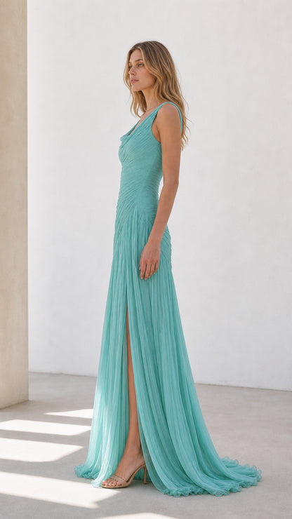 Side profile of aqua blue pleated evening dress showing draped silhouette