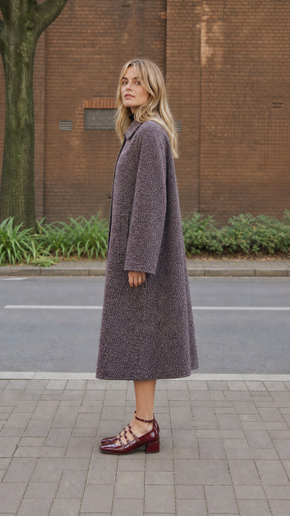 Side profile view of women's longline textured overcoat in Plum