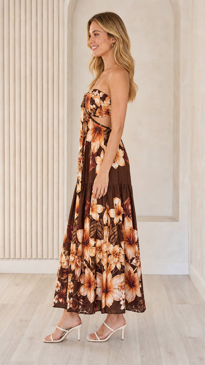 Side view of brown floral strapless maxi dress