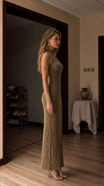 Side profile view of model in gold metallic dress