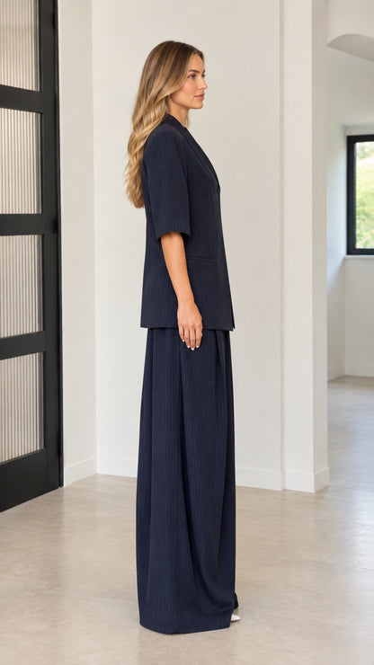 Side profile view of Navy Blue two-piece blazer and trouser set