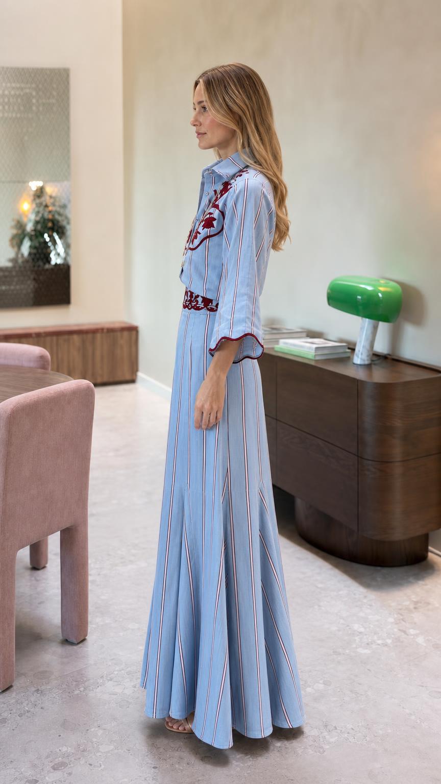 Side profile view of light blue striped jumpsuit