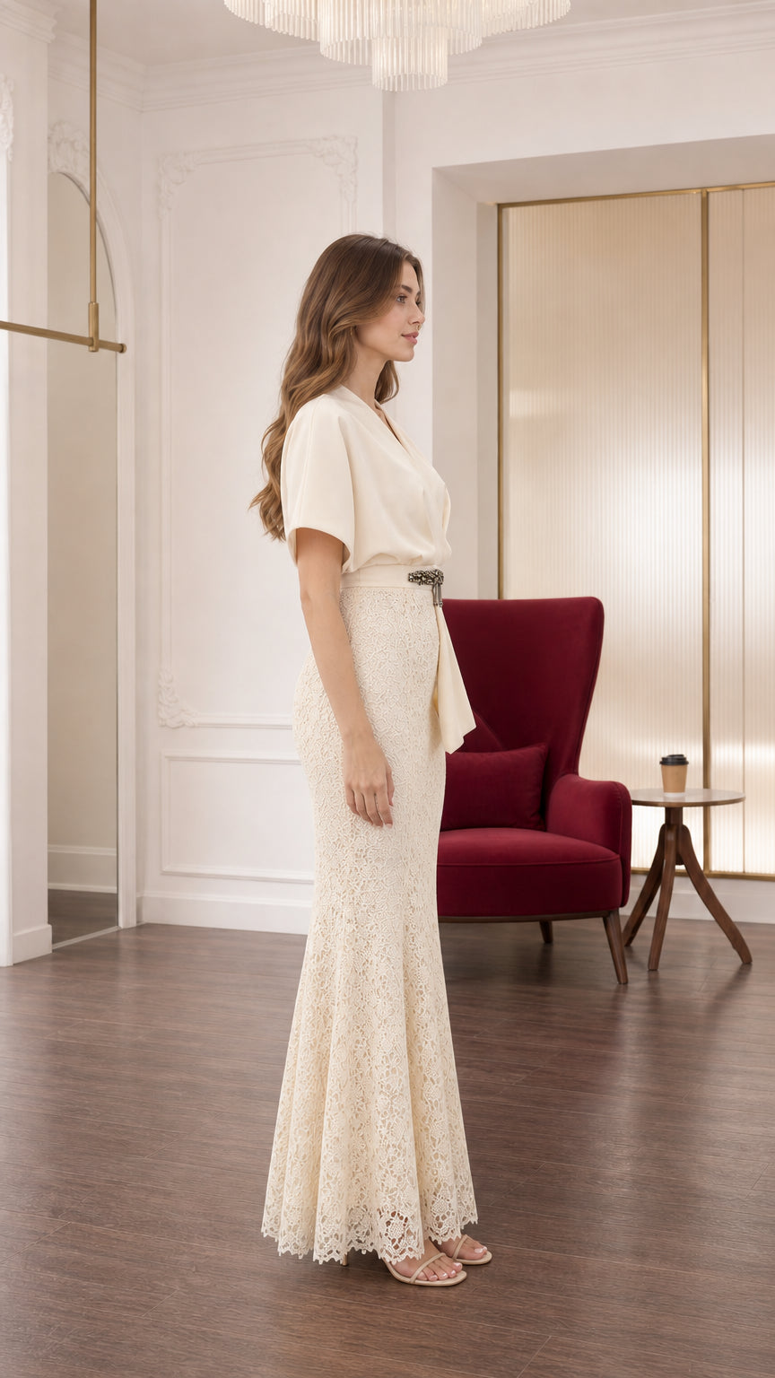 Side profile view of cream lace mermaid formal gown showing sleek silhouette