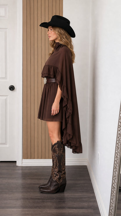 Side view of woman in brown cape mini dress