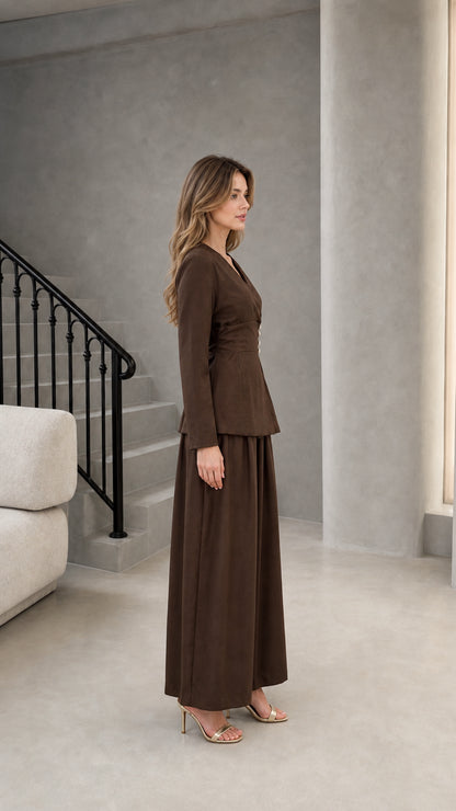 Side profile view of model wearing brown two-piece wrap pant set