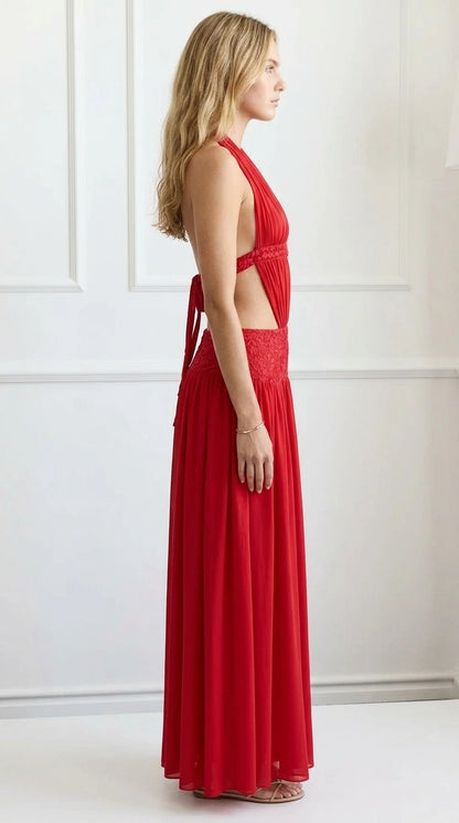 Side profile view of red cutout maxi dress