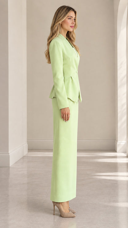 Side profile of model in mint green tailored peplum skirt suit