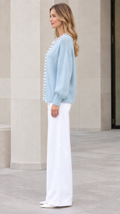 Model wearing Light Blue pearl-trimmed knit cardigan sweater side view