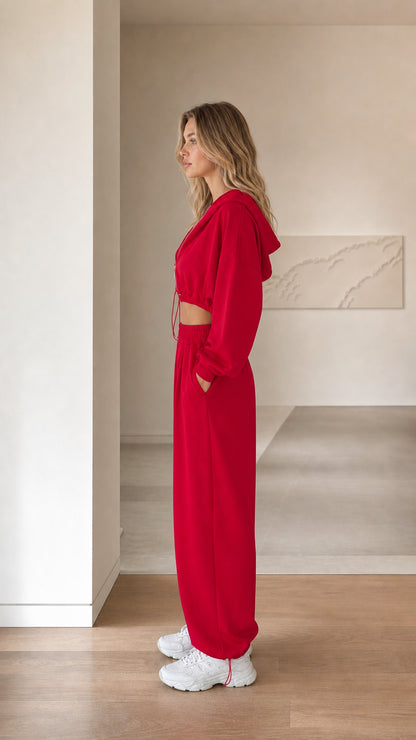 Side profile view of woman modeling red 3-piece loungewear tracksuit set