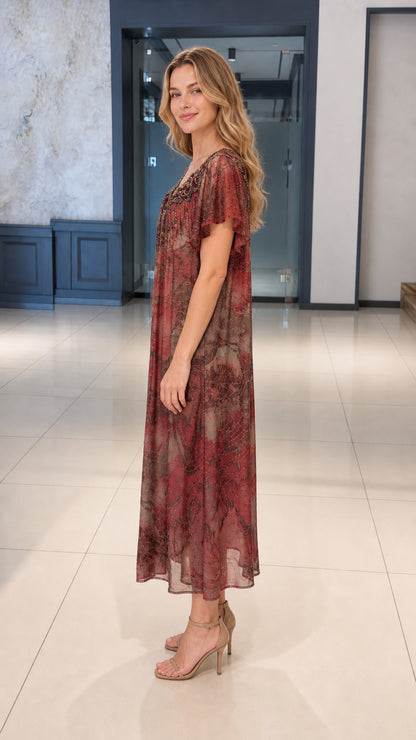 Side profile view of burgundy flutter sleeve pleated midi dress