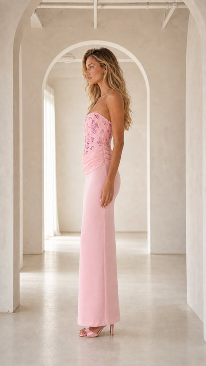 Side profile view of pink strapless corset formal maxi dress