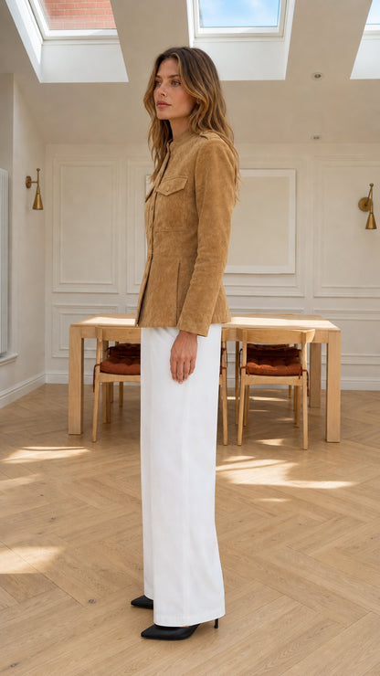 Side view of model wearing camel faux suede jacket showing tailored waist and profile
