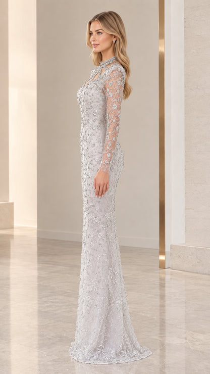 Side profile view of silver floor-length beaded formal dress