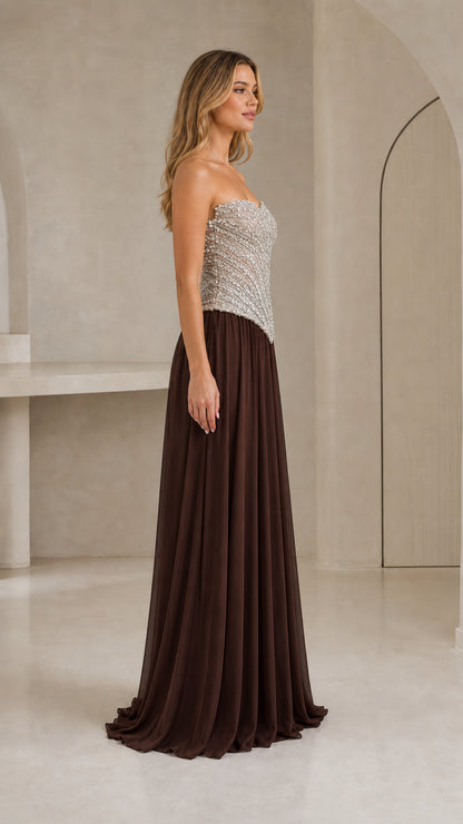 Side three-quarter view of chocolate brown formal maxi dress with silver sequined bodice
