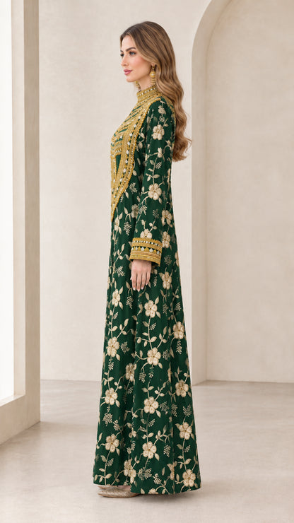 Side profile view of emerald green long sleeve floral embroidered gown