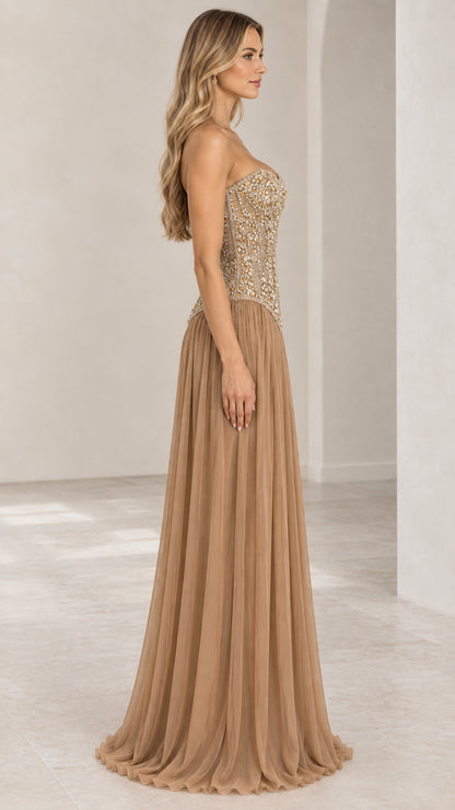 Side profile of champagne strapless formal gown with embellished corset bodice
