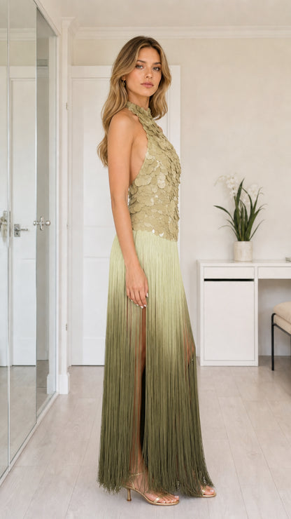Side profile of sage green sequin fringe gown showing side slit and halter fit