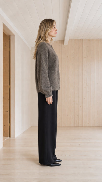 Side profile view of charcoal grey fuzzy button-down cardigan sweater