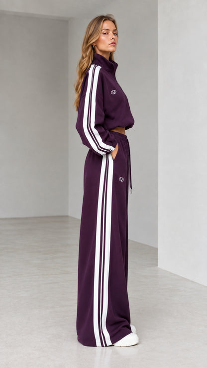 Side profile of woman in deep plum two-piece wide-leg sweatsuit set