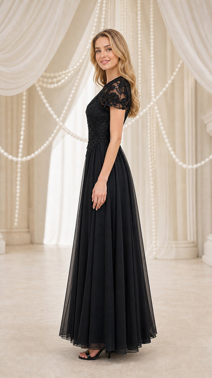 Model wearing black evening gown, side profile view