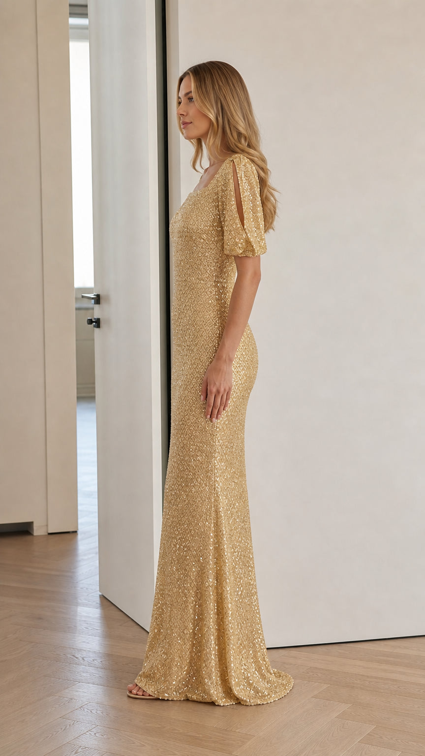 Gold sequin floor-length mermaid dress shown from the side