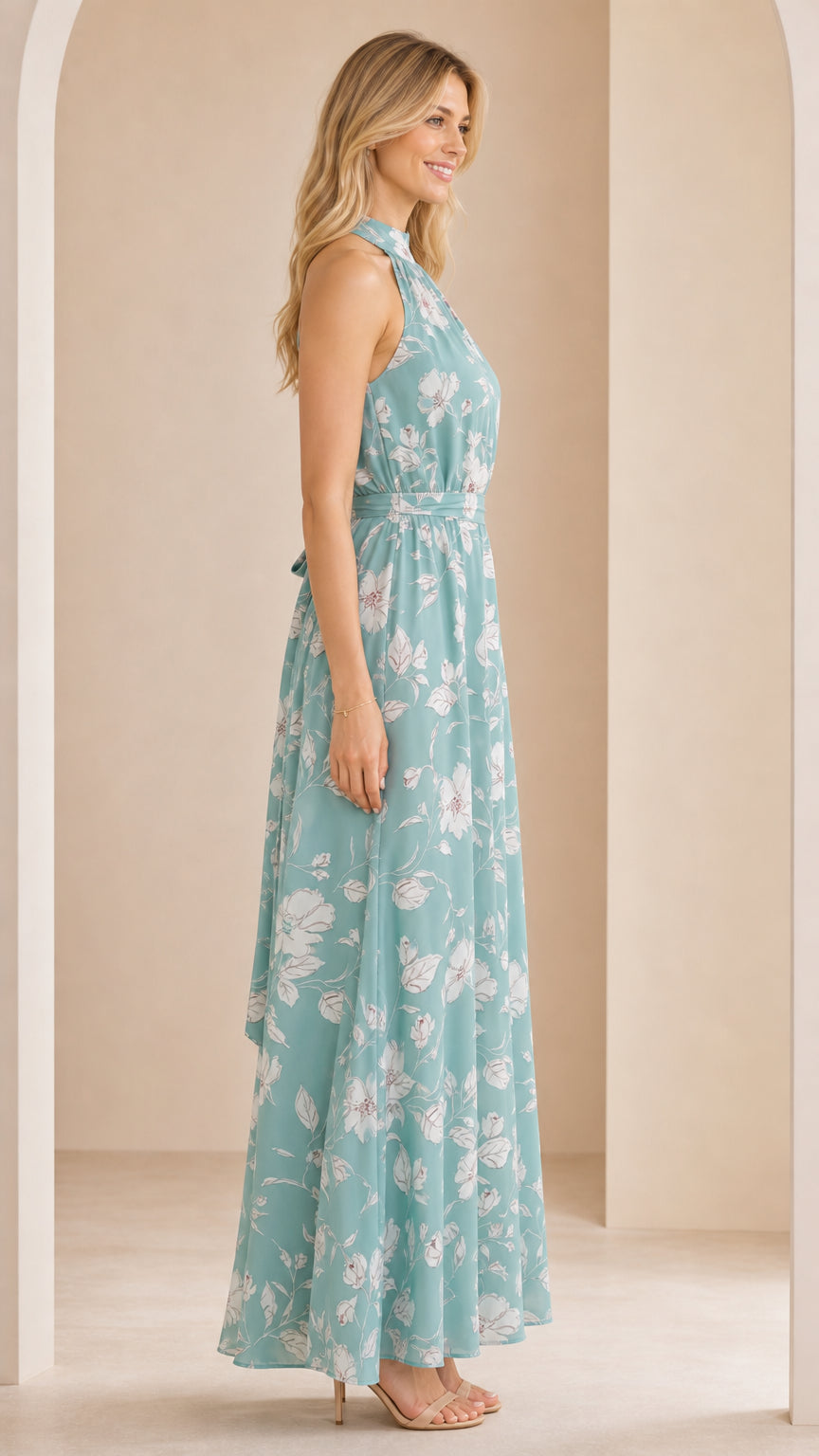 Side profile of woman wearing sage green floral halter maxi dress