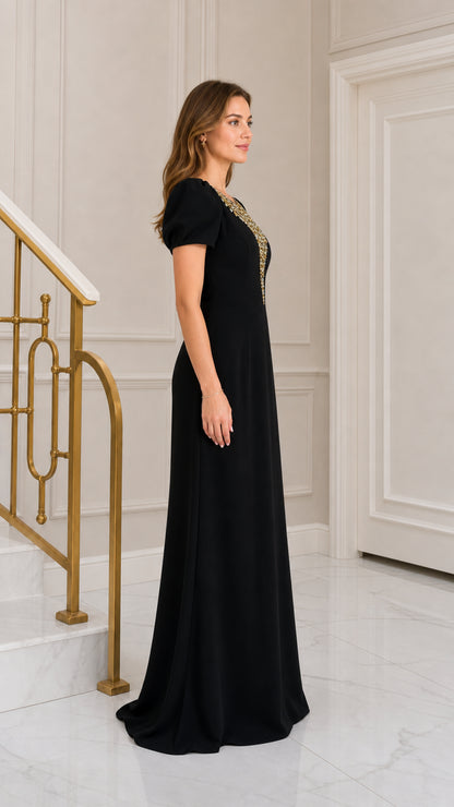Side profile view of black rhinestone-embellished puff sleeve formal maxi gown